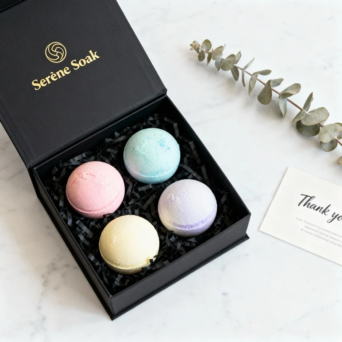 This is a premium, top-down unboxing shot showcasing an elegant bath bomb gift set on a clean marble surface. - ai product photography