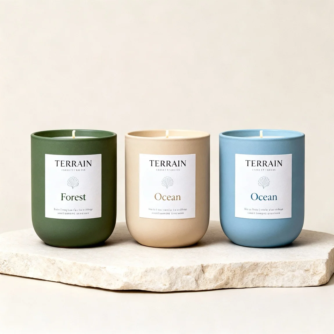 This shot displays a collection of three different candles from the same brand, showcasing the product range. - ai product photography
