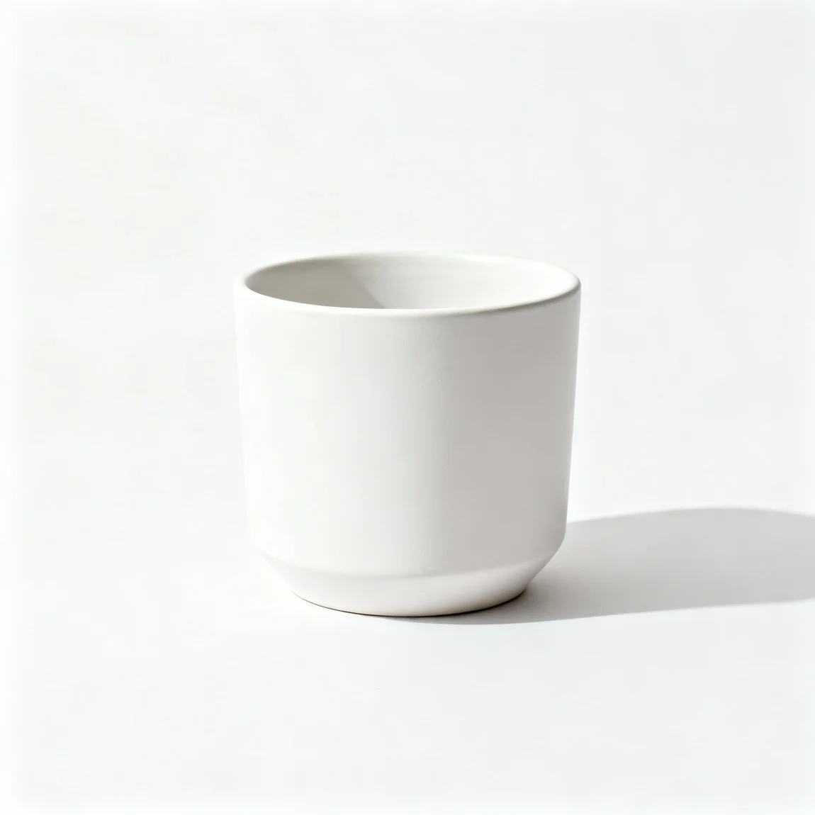 This is a clean, product-focused shot of a single empty planter on a seamless, light grey background. - ai product photography